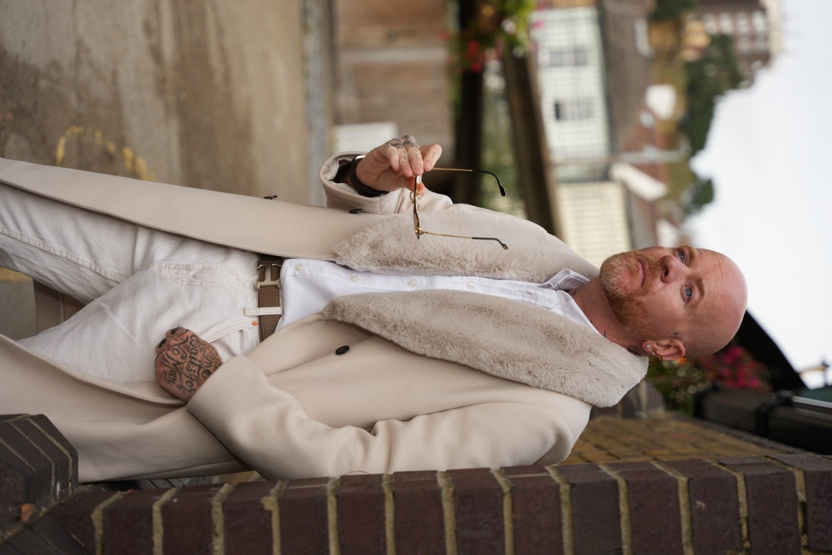 Carl Reader, cream coat with fur collar